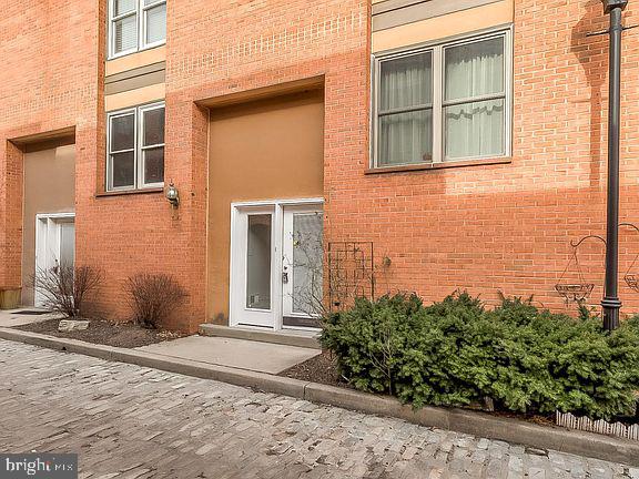 136 Welcome Alley, Unit TH2 Baltimore, MD 21201 - Photo 2 of 39 Charming urban entrance with greenery.