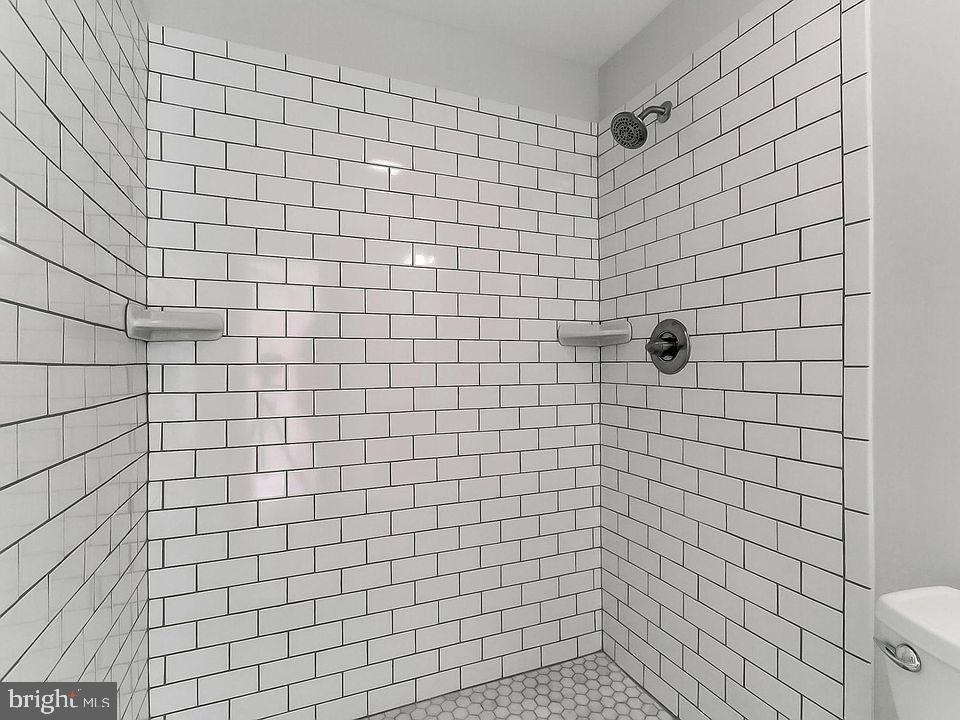 136 Welcome Alley, Unit TH2 Baltimore, MD 21201 - Photo 25 of 39 Sleek, modern shower with classic tiles.