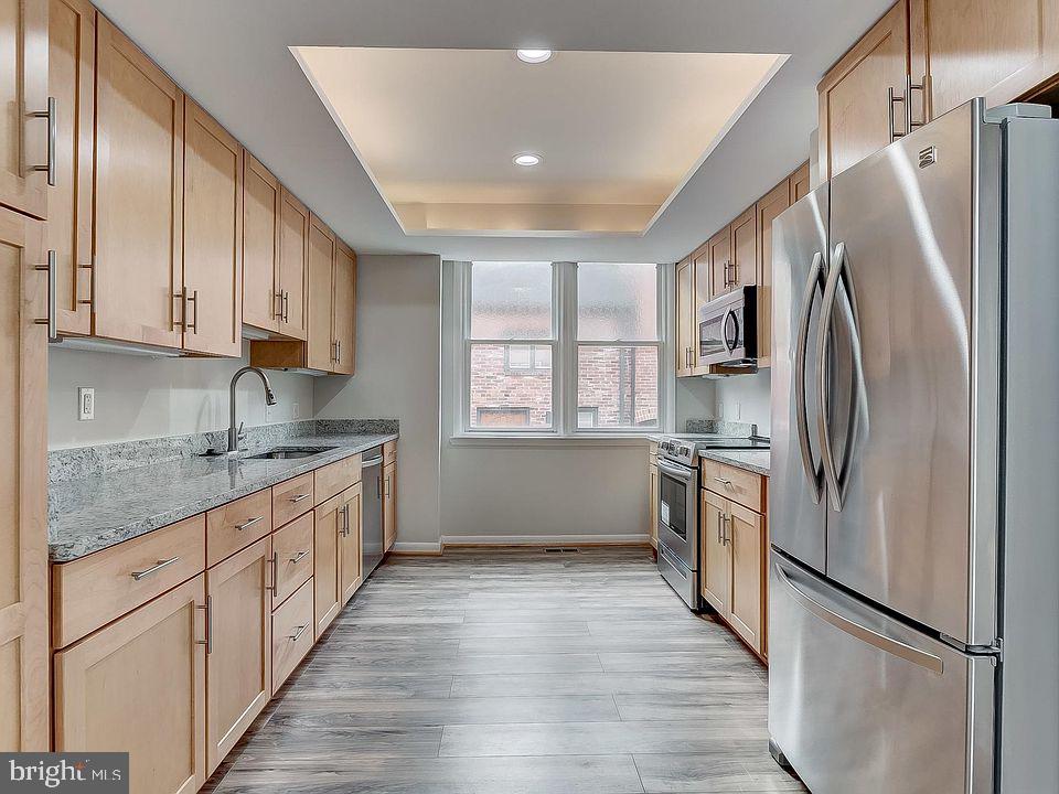 136 Welcome Alley, Unit TH2 Baltimore, MD 21201 - Photo 10 of 39 Modern kitchen with sleek finishes.