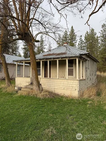 a house that has tree in front of it