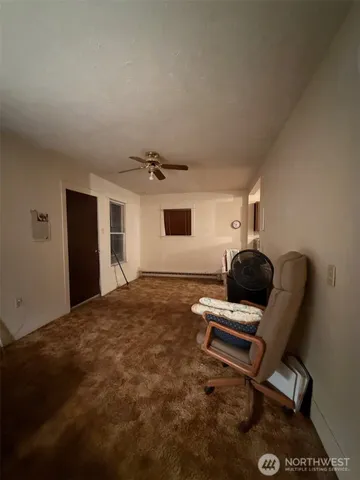 a living room with a couch and a window