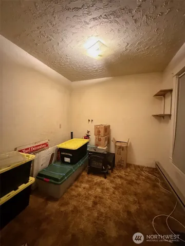 a kitchen with a refrigerator and a sink