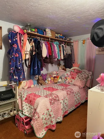 a bed room with a bed and a couch