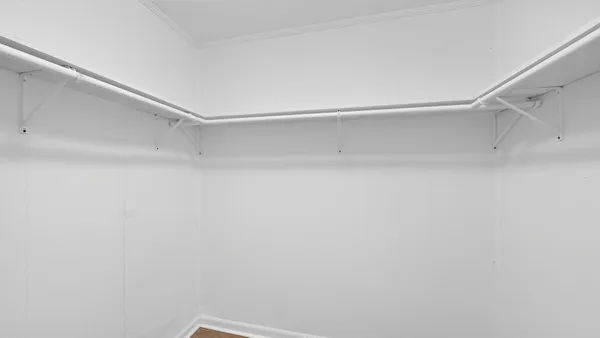 a view of an empty walk in closet