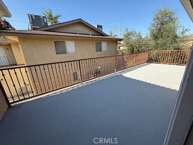 8724 Ramona Street, Unit 4 Bellflower, CA 90706 - Photo 7 of 7 a view of a house with a roof deck