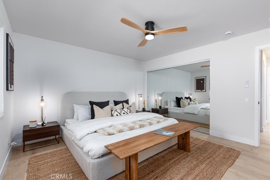 26002 Adamor Road Calabasas, CA 91302 - Photo 15 of 39 a bedroom with a bed and a chandelier