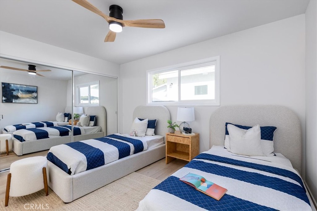 26002 Adamor Road Calabasas, CA 91302 - Photo 20 of 39 a bedroom with furniture and a chandelier