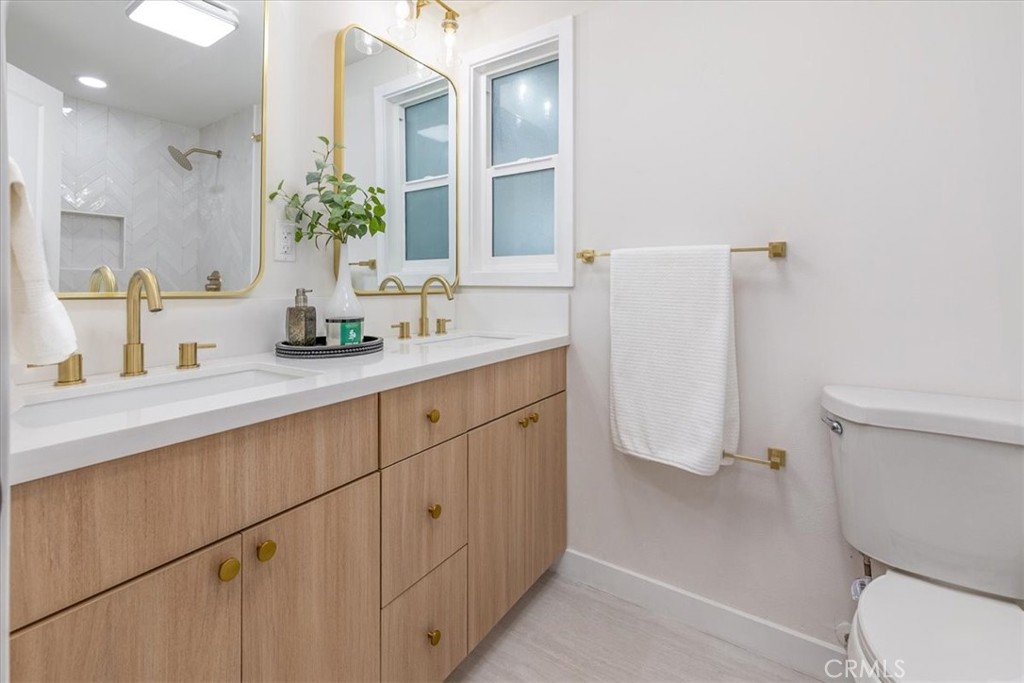 26002 Adamor Road Calabasas, CA 91302 - Photo 21 of 39 a bathroom with a sink toilet and shower