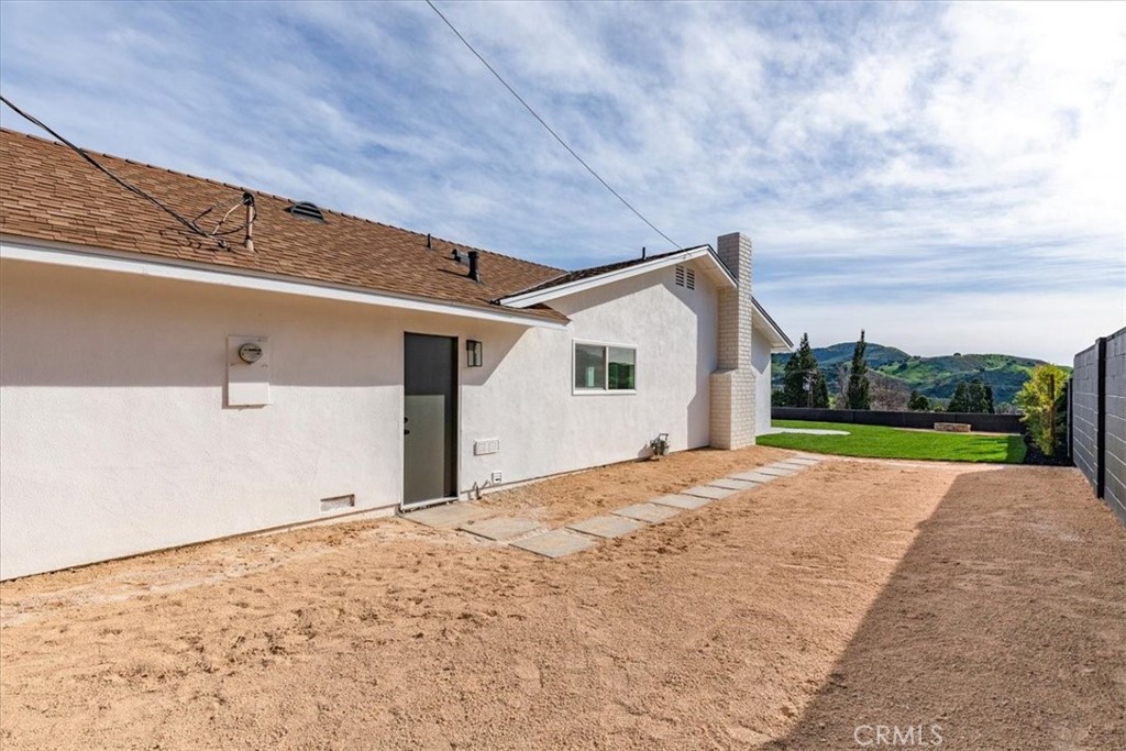 26002 Adamor Road Calabasas, CA 91302 - Photo 35 of 39 a view of an house with backyard and road