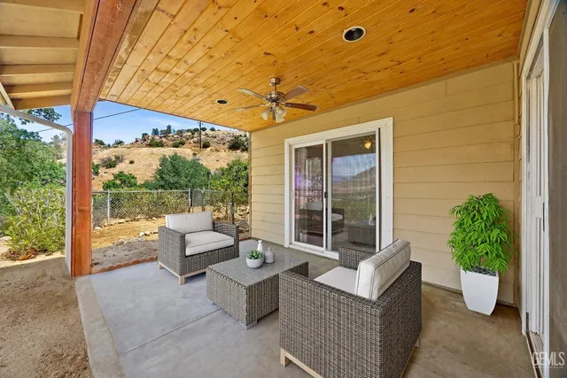 a view of a porch with wooden floor and outer view