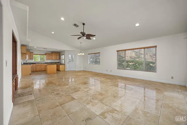 a view of a kitchen with a sink and a window