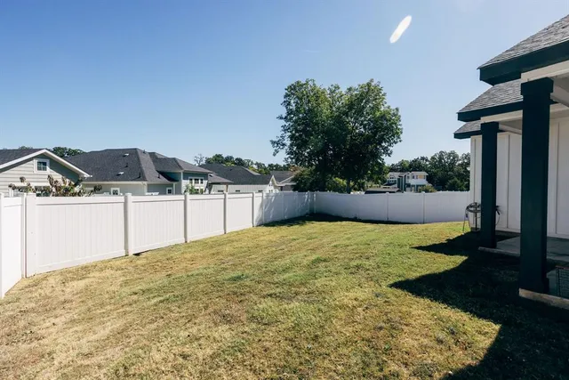 a view of a backyard of the house