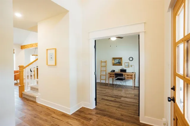 a view of living room and dining room with wooden floor