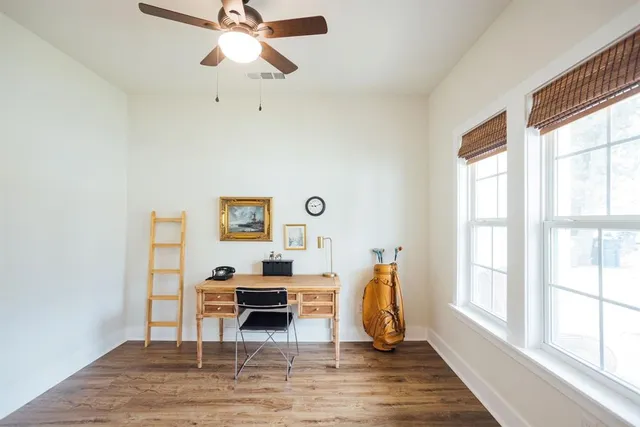 a living room with furniture a window and a chandelier