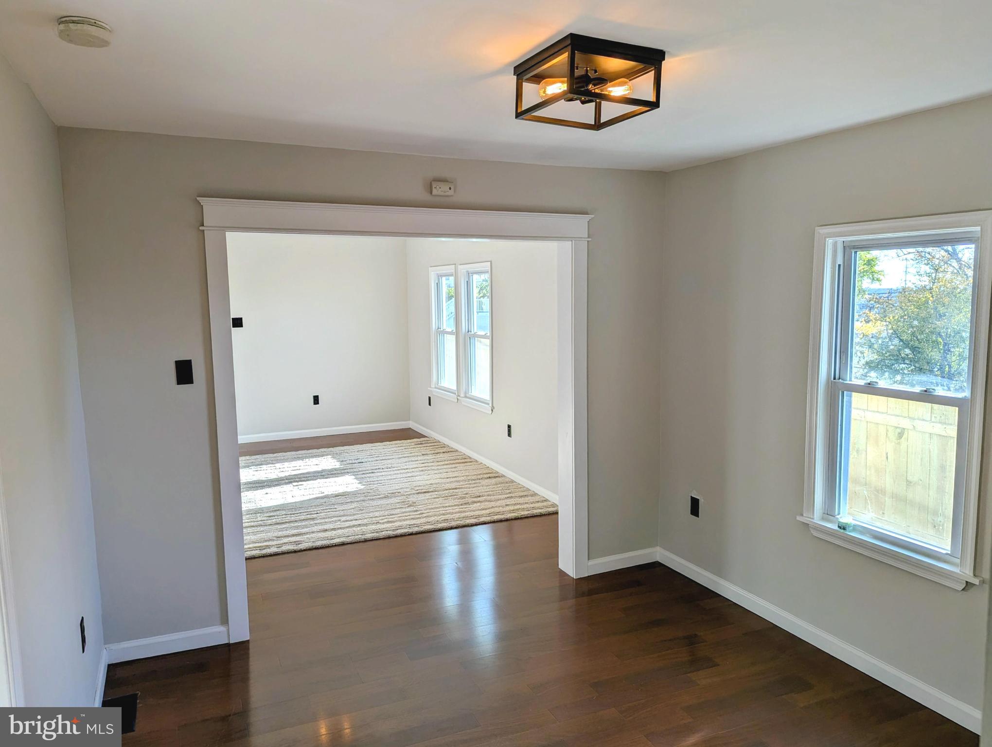 1400 Beale Street Marcus Hook, PA 19061 - Photo 6 of 17 an empty room with wooden floor and windows