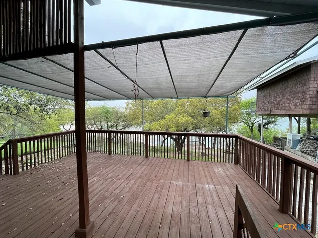 a view of a balcony with wooden floor