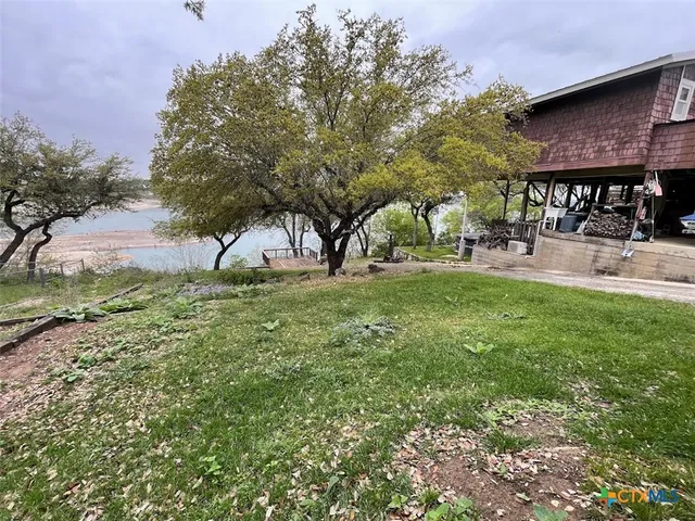 a view of a backyard with sitting area