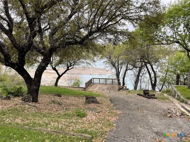 a view of outdoor space with large trees