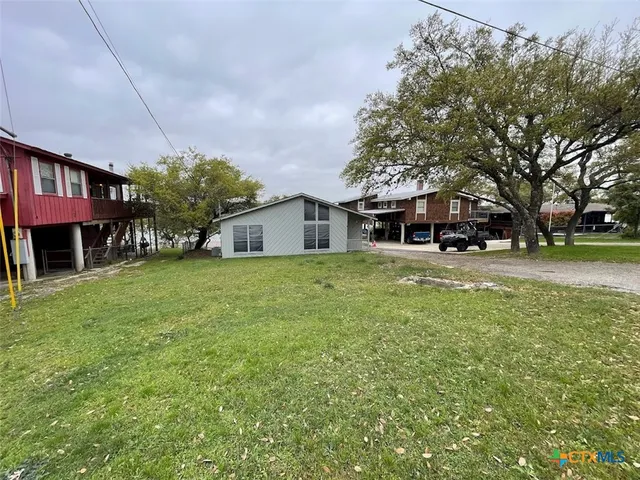 a house view with a sitting space and garden view