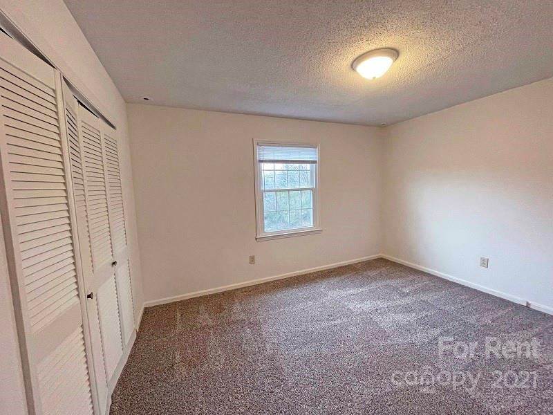 4887 County Home Road, Unit A3 Conover, NC 28613 - Photo 8 of 8 an empty room with a window