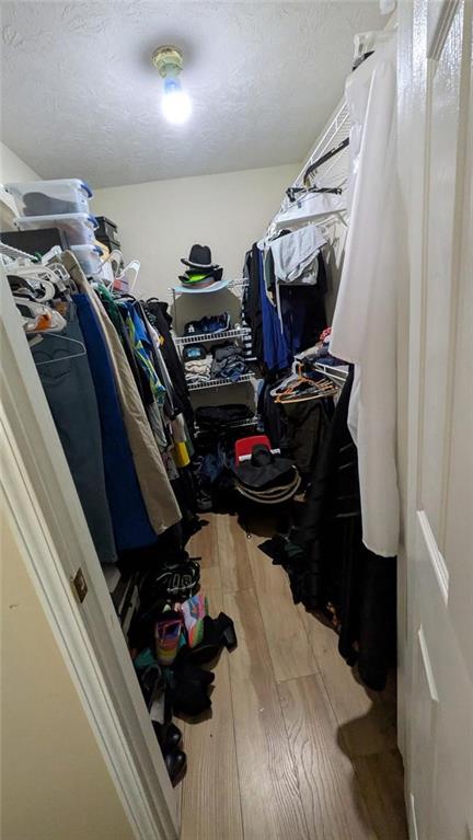 230 Overlook Drive Covington, GA 30016 - Photo 16 of 34 a view of walk in closet with clothes and shoes