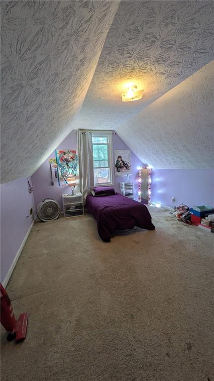 230 Overlook Drive Covington, GA 30016 - Photo 27 of 34 a bedroom with furniture and a chandelier