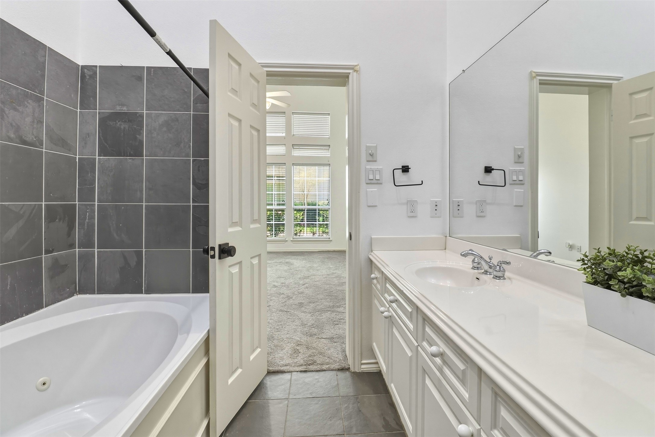 2918 Ranch Road 620, Unit 265 Austin, TX 78734 - Photo 19 of 40 A well-appointed bathroom features a deep soaking tub and a spacious vanity.