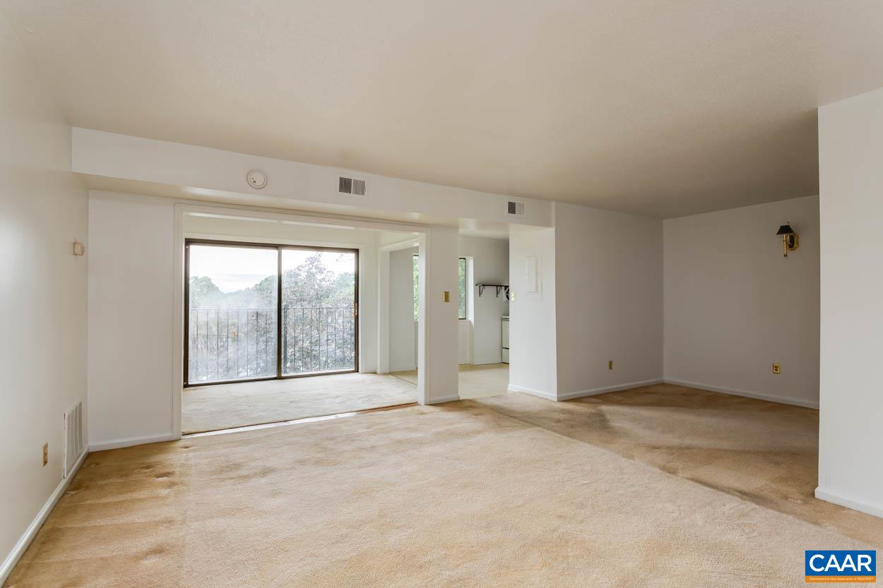 24 Spring Court Charlottesville, VA 22901 - Photo 11 of 23 an empty room with a empty space and windows