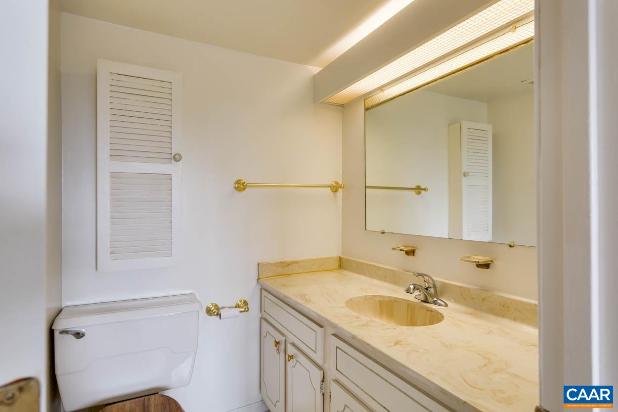 24 Spring Court Charlottesville, VA 22901 - Photo 18 of 23 a bathroom with a sink and a mirror