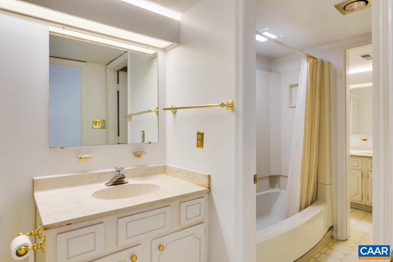 24 Spring Court Charlottesville, VA 22901 - Photo 19 of 23 a bathroom with a sink and a mirror