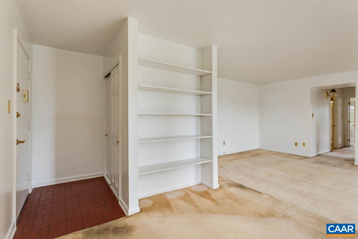24 Spring Court Charlottesville, VA 22901 - Photo 4 of 23 a view of an empty room with cabinet and a window