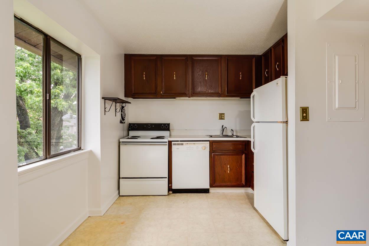 24 Spring Court Charlottesville, VA 22901 - Photo 6 of 23 a kitchen with a refrigerator and a stove top oven