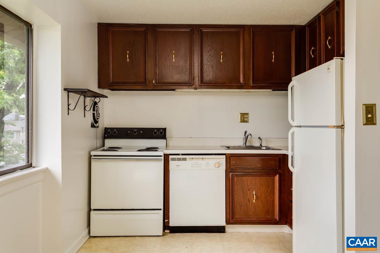 24 Spring Court Charlottesville, VA 22901 - Photo 7 of 23 a kitchen with a refrigerator and a stove top oven