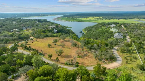 a view of a lake with a yard