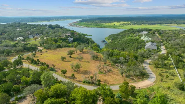a view of a lake with a yard