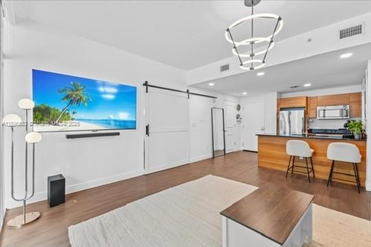 3301 Northeast 1st Avenue, Unit L0202 Miami, FL 33137 - Photo 4 of 25 a living room with furniture and a chandelier