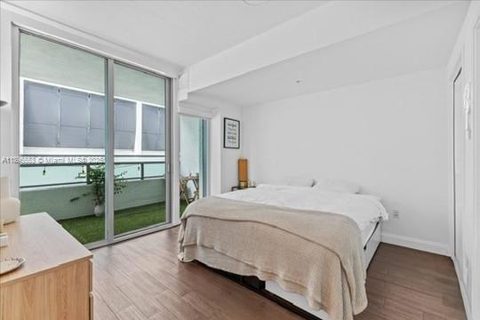 3301 Northeast 1st Avenue, Unit L0202 Miami, FL 33137 - Photo 7 of 25 a bedroom with a bed and a cabinets