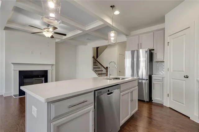 a view of a house with wooden fence