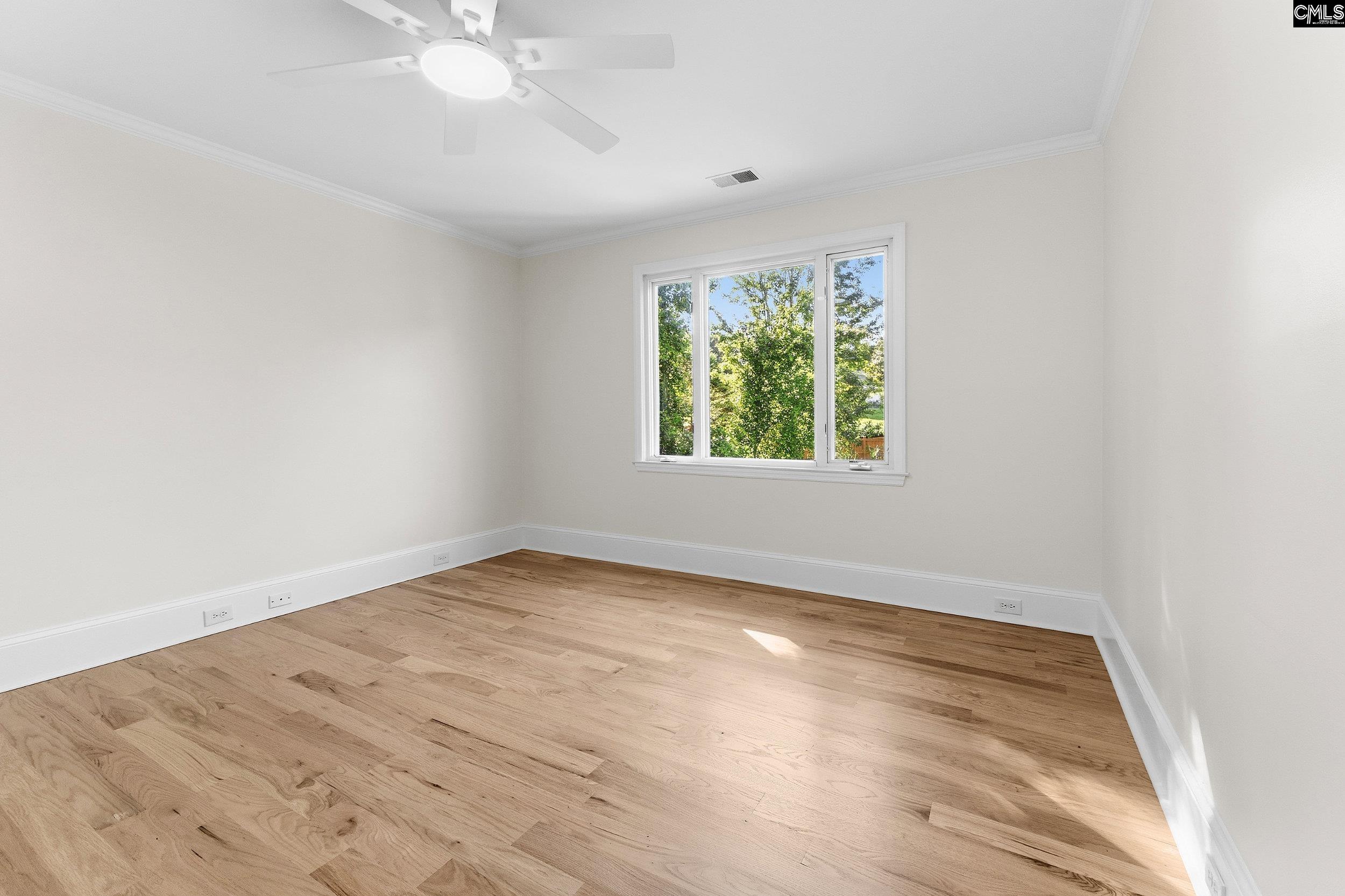 121 Silver Lake Road East Columbia, SC 29223 - Photo 50 of 57 an empty room with wooden floor and windows