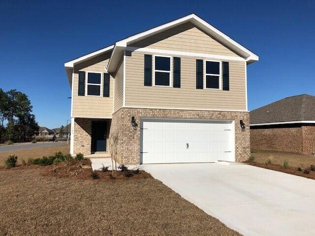 2853 Patriots Rdg Drive Crestview, FL 32539 - Photo 1 of 13 a front view of a house with a yard
