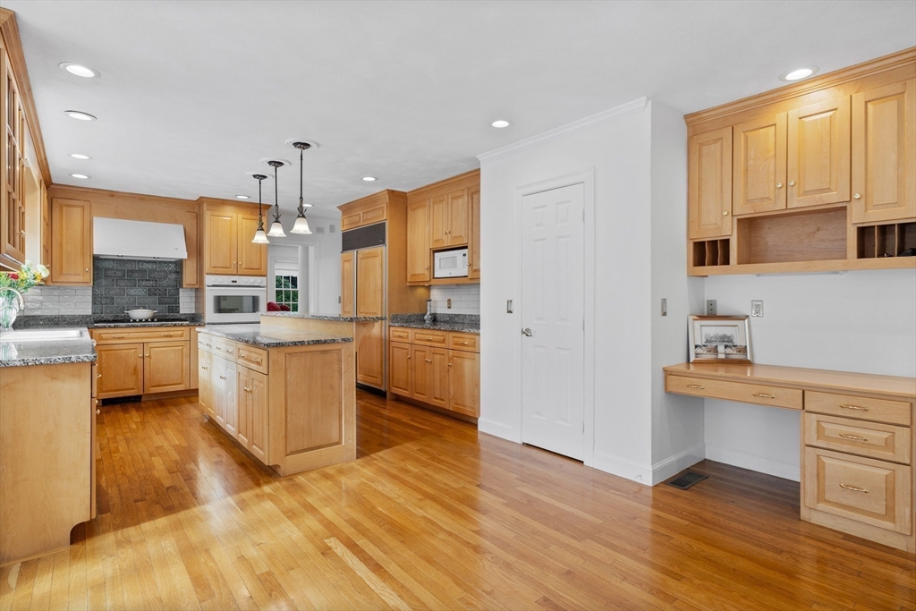15 Stafford Road Lynnfield, MA 01940 - Photo 14 of 39 a kitchen with stainless steel appliances a refrigerator sink and cabinets