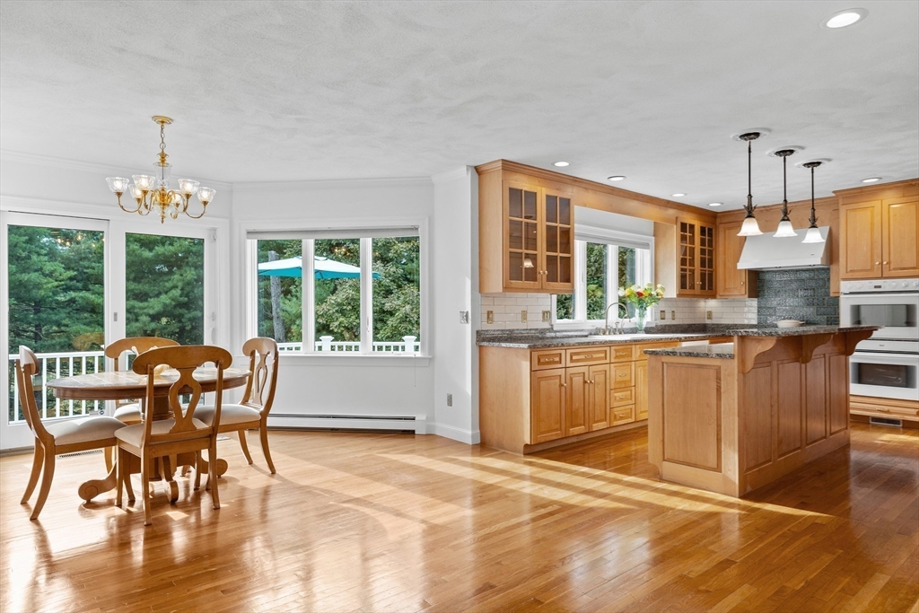 15 Stafford Road Lynnfield, MA 01940 - Photo 15 of 39 a living room with kitchen island furniture and a large window