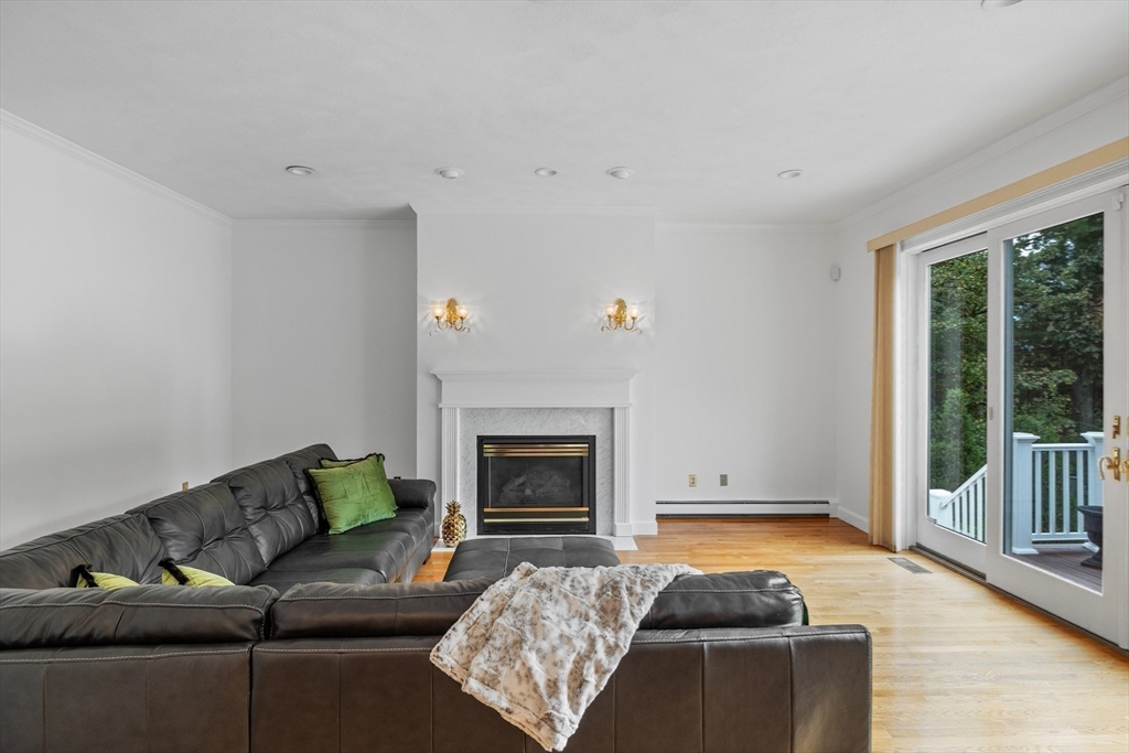 15 Stafford Road Lynnfield, MA 01940 - Photo 19 of 39 a living room with furniture and a fireplace