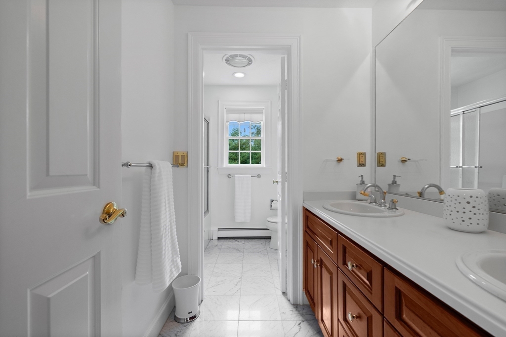 15 Stafford Road Lynnfield, MA 01940 - Photo 29 of 39 a bathroom with a sink a mirror and a shower