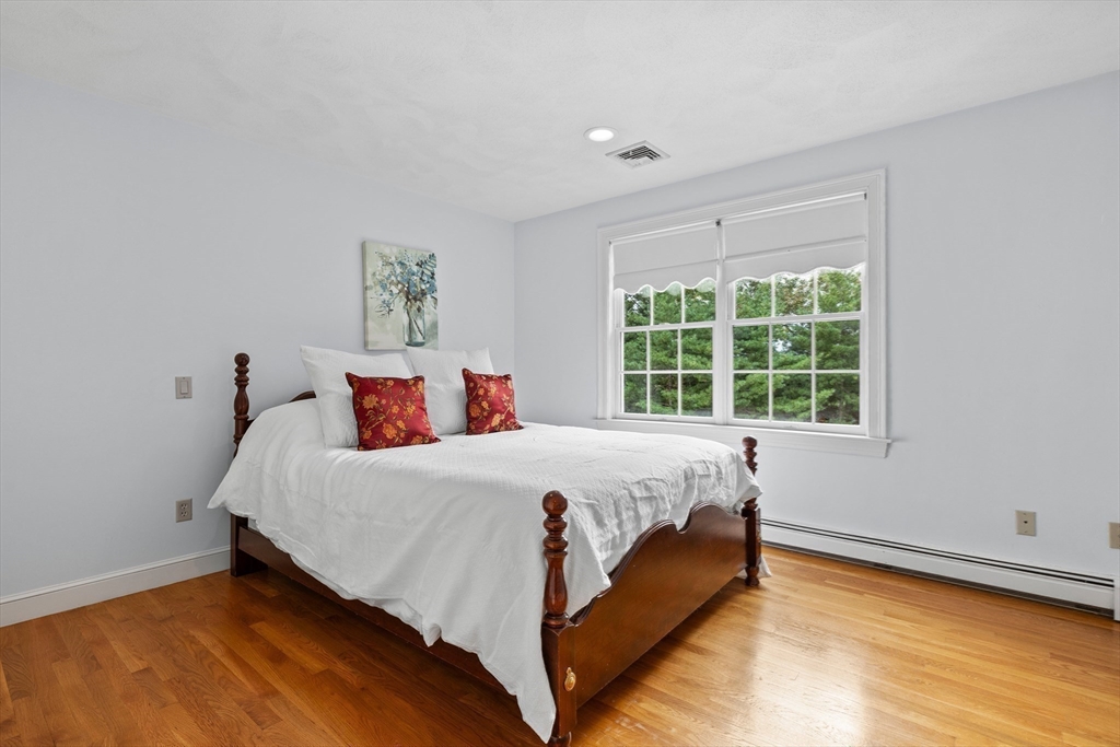 15 Stafford Road Lynnfield, MA 01940 - Photo 30 of 39 a bed sitting in a bedroom next to a window