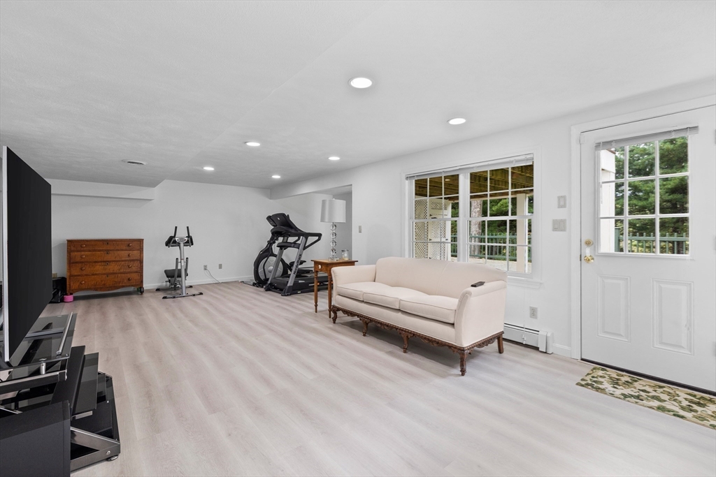 15 Stafford Road Lynnfield, MA 01940 - Photo 31 of 39 a living room with furniture and a flat screen tv