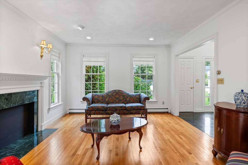 15 Stafford Road Lynnfield, MA 01940 - Photo 9 of 39 a living room with furniture and a fireplace
