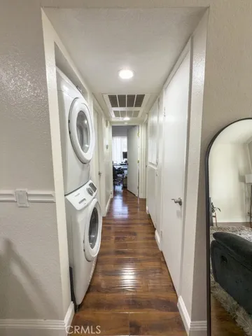 a view of a hallway with washer and dryer