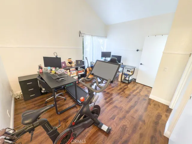 a workspace with furniture and wooden floor