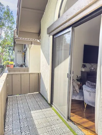 a bathroom with a granite countertop sink a toilet and a shower